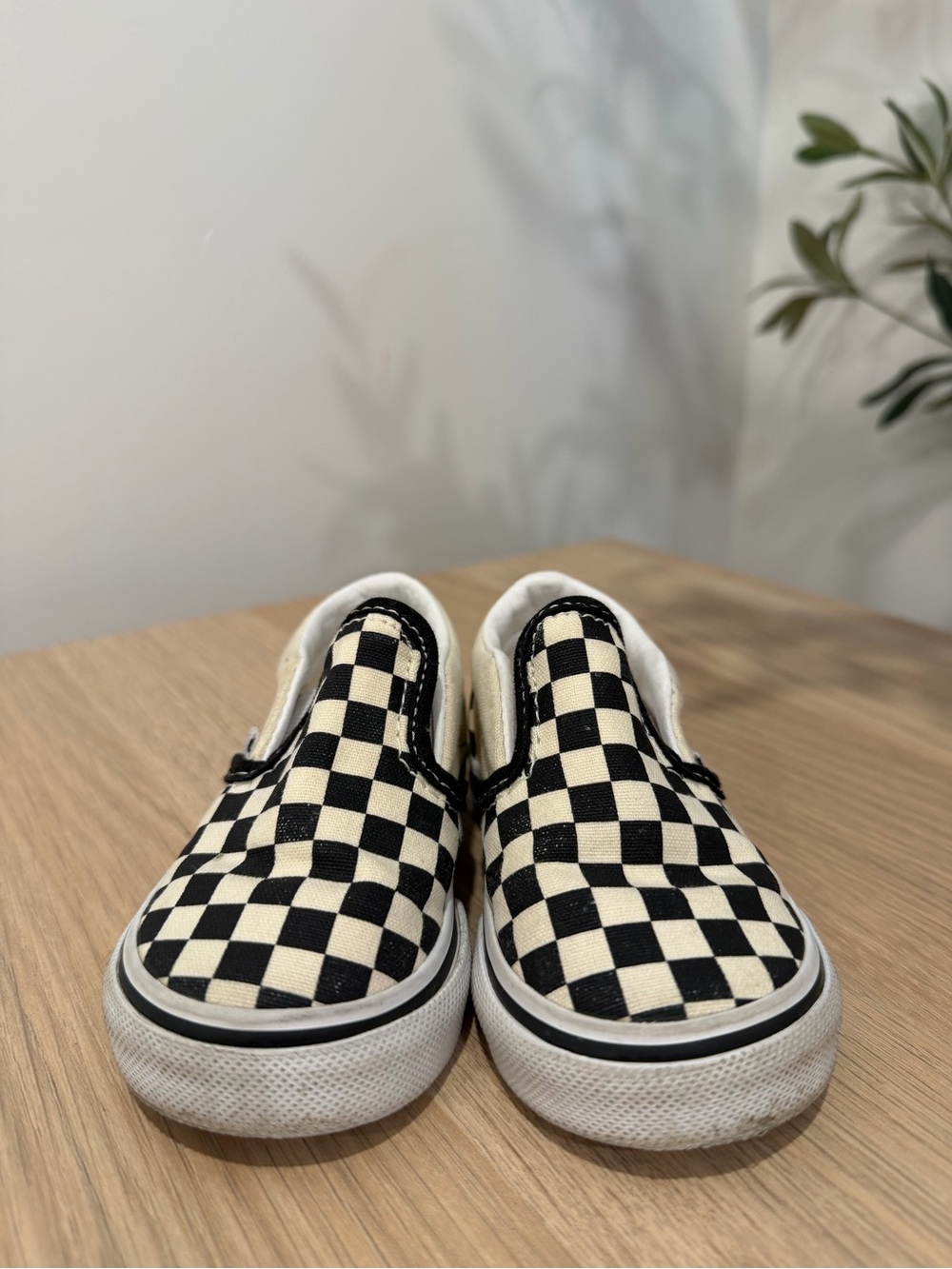 Vans Checkerboard Slip-On Sneakers in Black and Cream